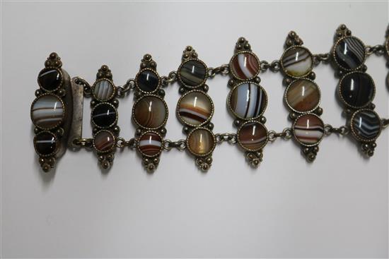 Two banded agate bracelets, one in gilt metal, one in white metal.